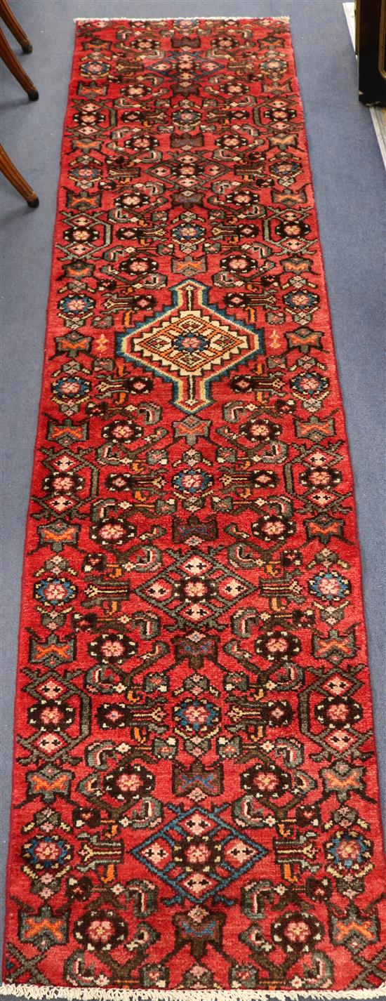 A Hamadan red ground runner, 7ft 1in by 1ft 9in.